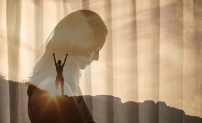 Woman reflects, with image overlay of her hands in air as she celebrates reaching the top of a hill