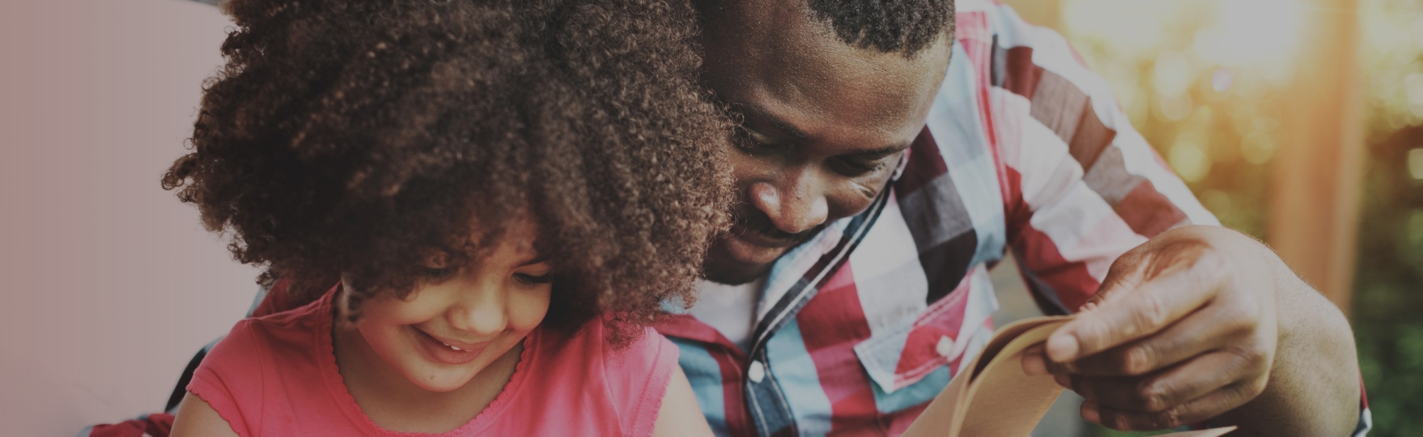 father and daughter reading together