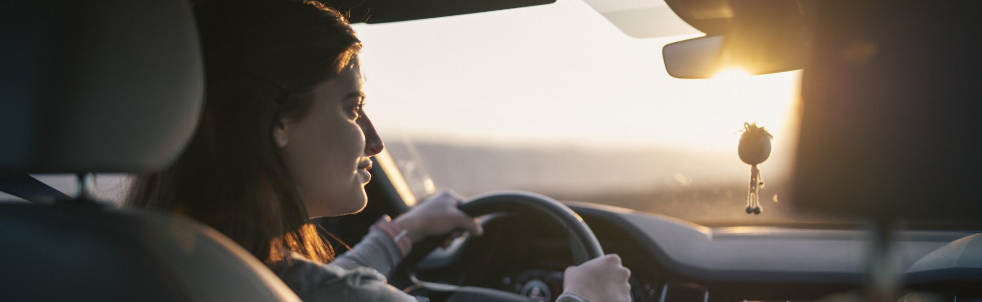 Woman driving vehicle